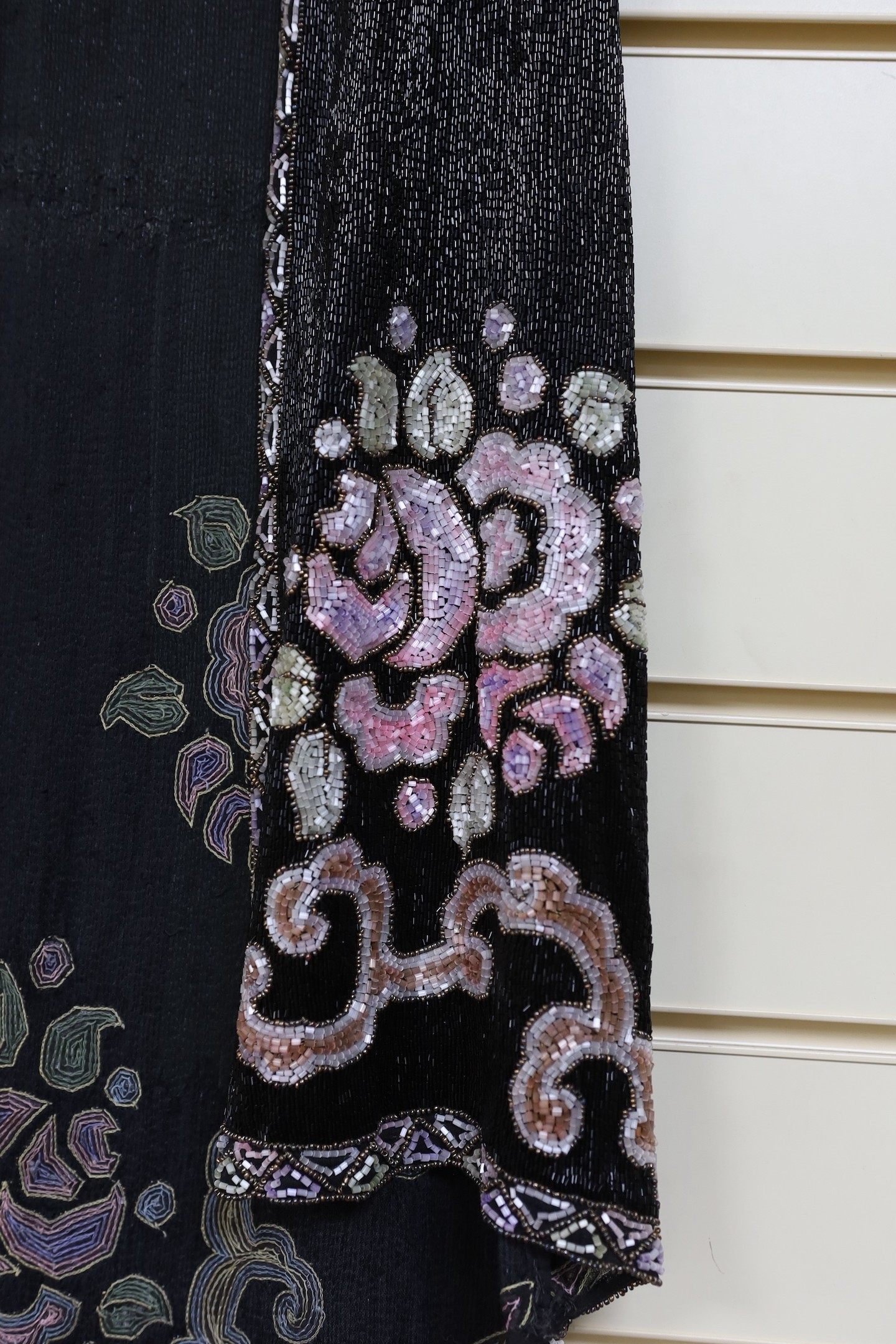 A 1920's multi-coloured beadwork sleeveless evening jacket
